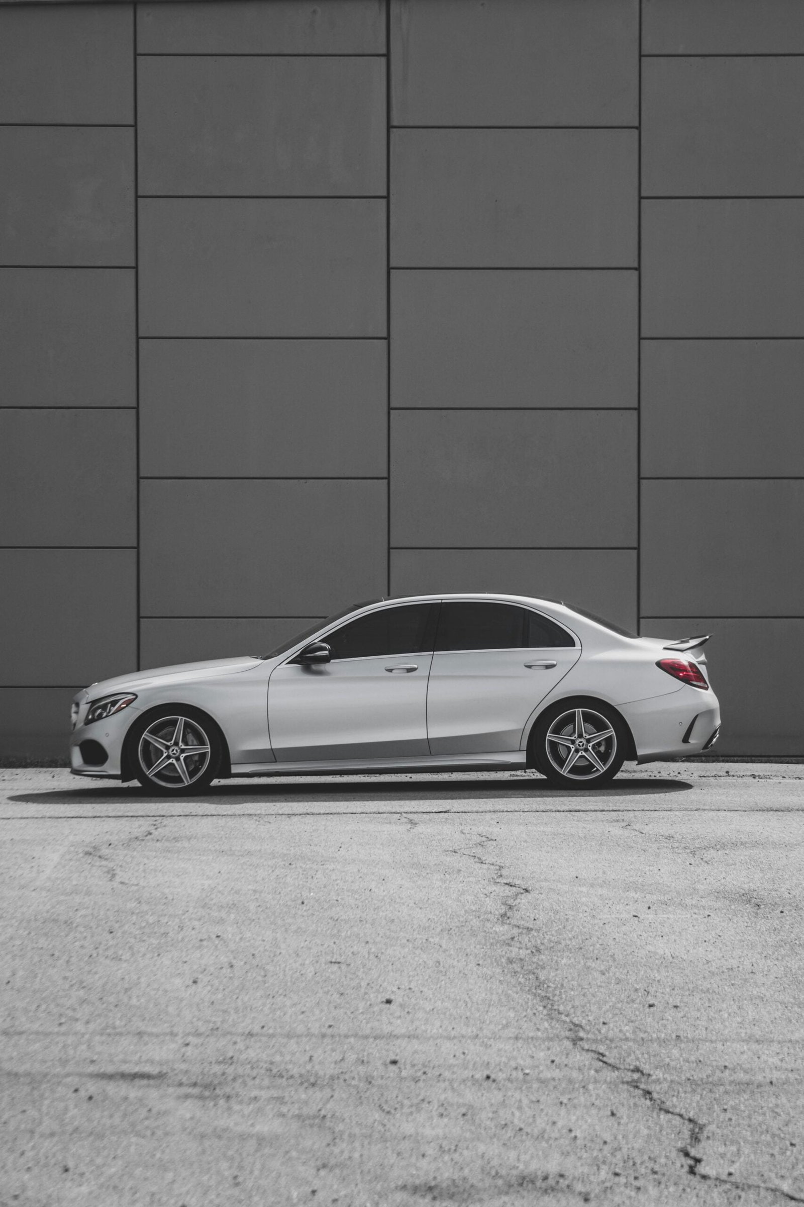 a white car parked in front of a building