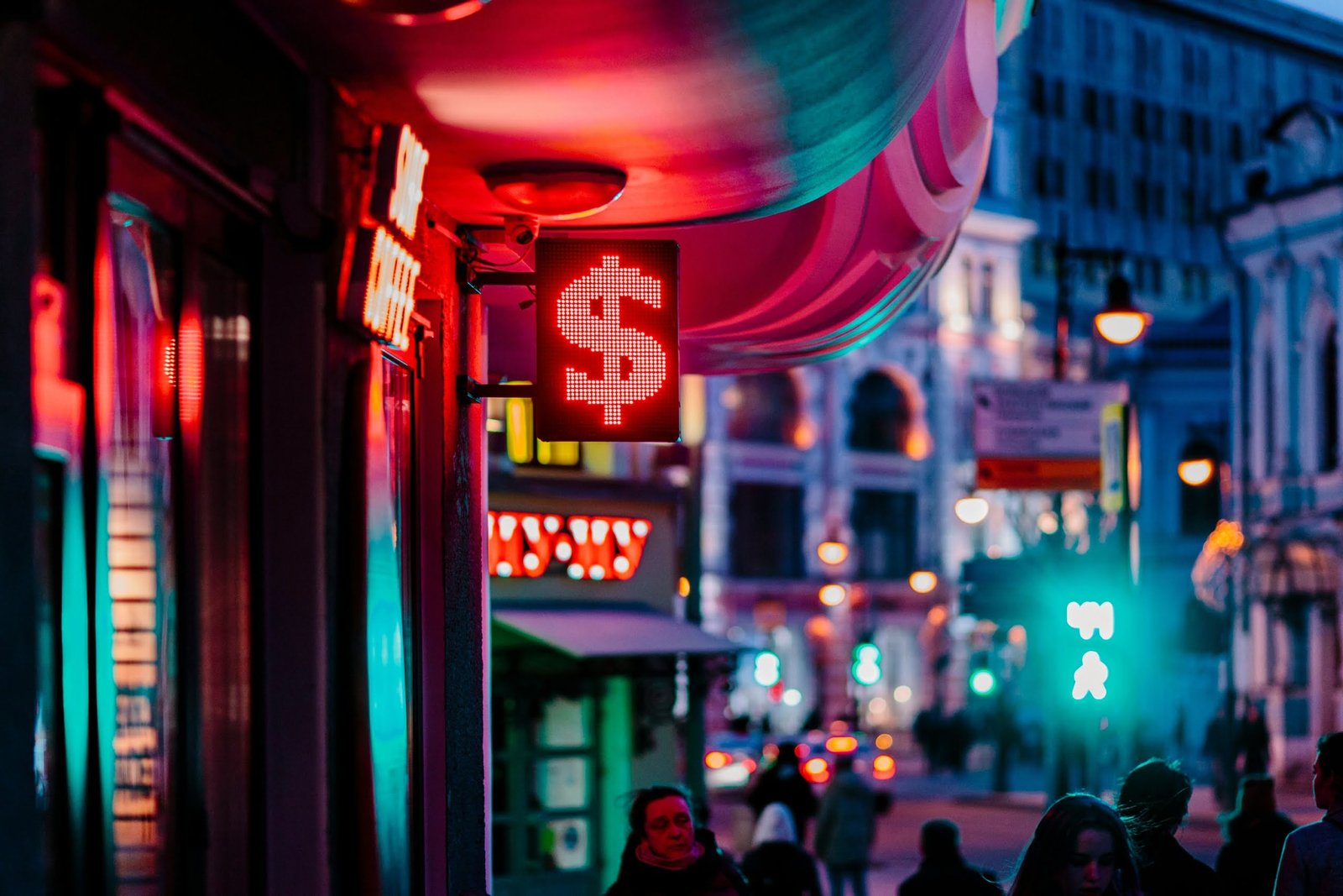 people walking on street during night time